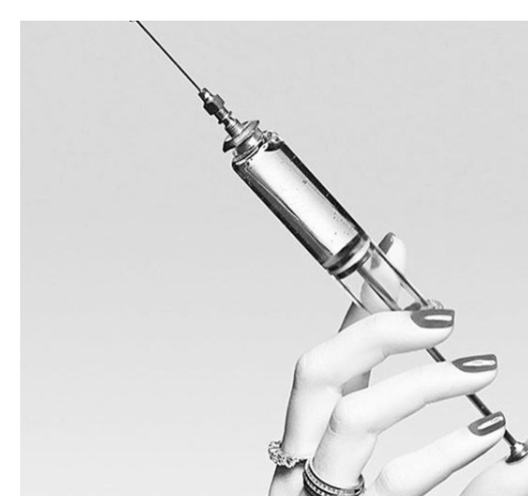 Vintage-style image of an injection syringe